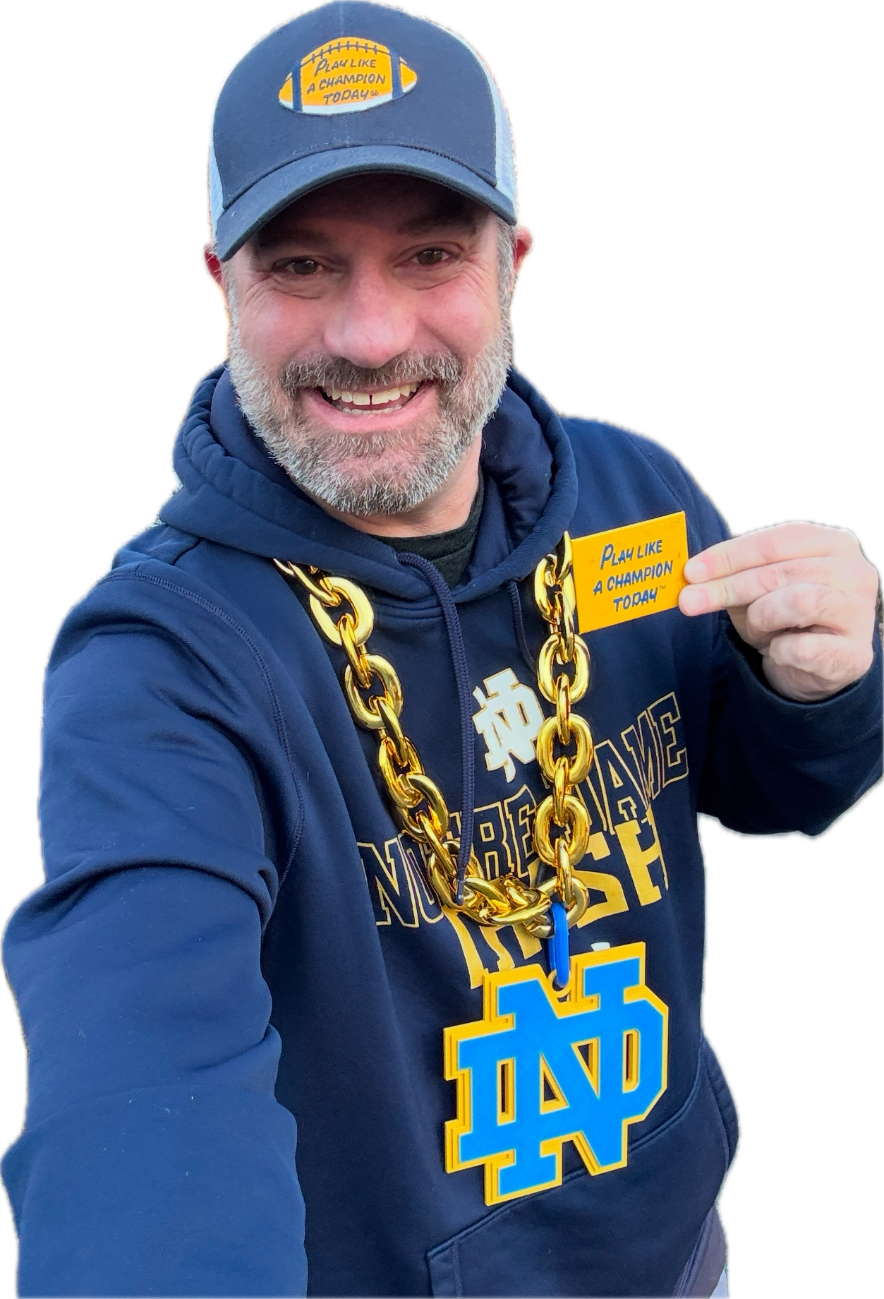 Matt Owen wearing his Notre Dame gear and holding a Play Like a Champion Today sign